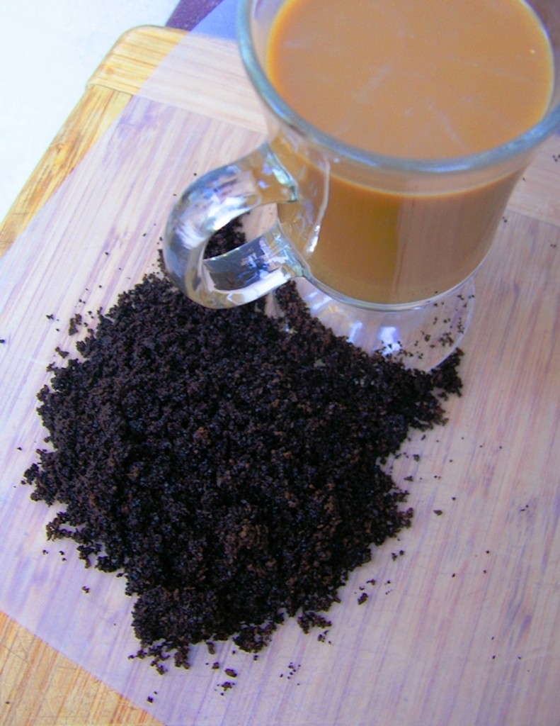 Cup of coffee with coffee grounds.